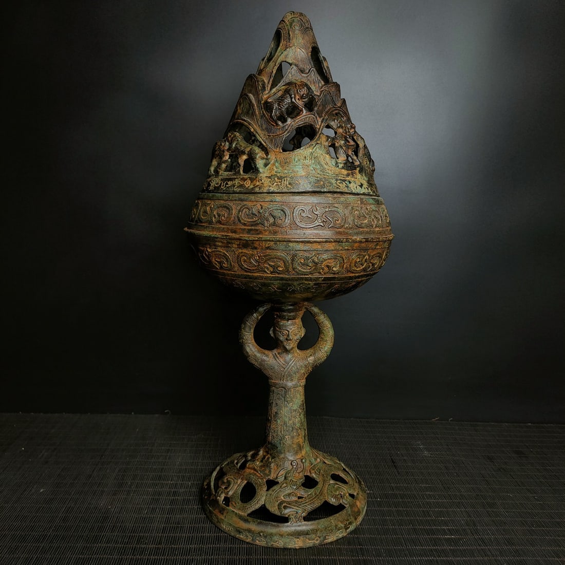 An Archaic Bronze Figure-Shaped Censer: An Archaic Bronze Figure-Shaped Censer,the Warring States period in China,Size:18.5inx8.3in,Weight:3200g青铜人物形熏炉,中国战国时