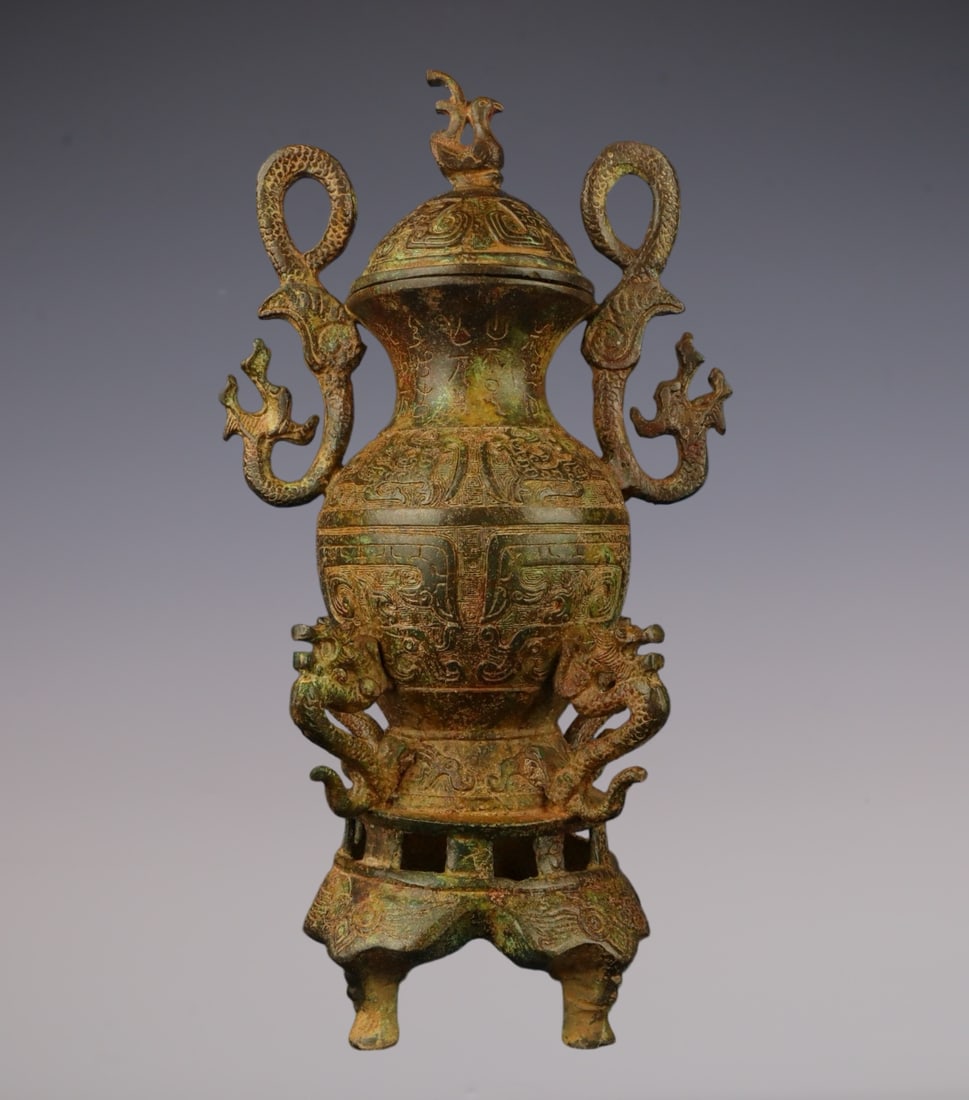 An Archaic Bronze Auspicious Beast Pattern Dragon-Ears Vase: An Archaic Bronze Auspicious Beast Pattern Dragon-Ears Vase,W.Zhou ,China,Size:7.1inx12.6in,Weight:2100g青铜瑞兽纹龙耳瓶,中国西周