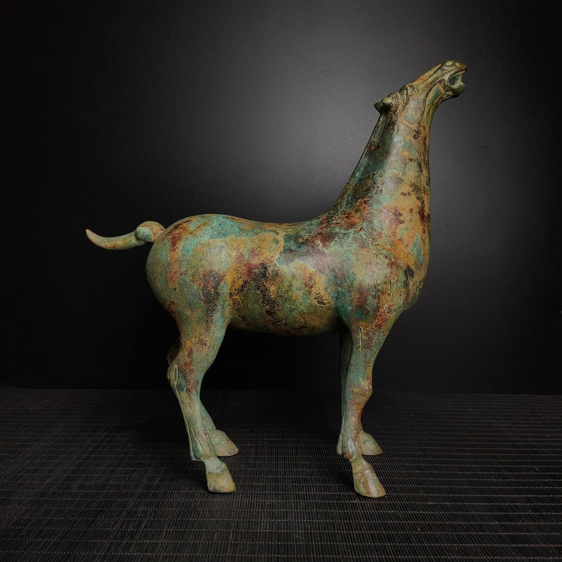 An Archaic Bronze Horse Ornament: An Archaic Bronze Horse Ornament,the Warring States period in China,Size:13.4inx13.4in,Weight:2100g青铜马摆件,中国战国时期,Size:34cmx3