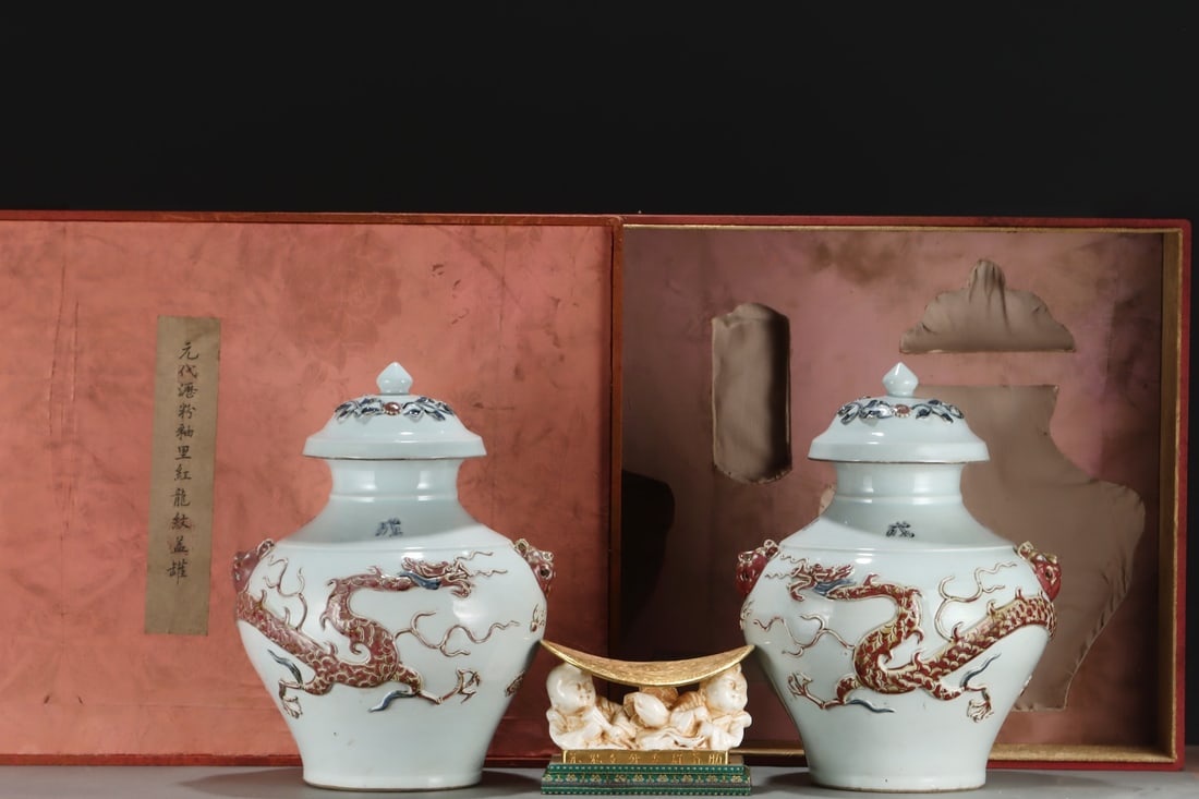 An Exquisite Underglaze-Red Dragon Pattern Lotus Pattern Double-Ears Jar: An Exquisite Underglaze-Red Dragon Pattern Lotus Pattern Double-Ears Jar Yuan Dynasty, China Size:17.9inx13.6in沥粉釉里红龙纹盖罐 中国