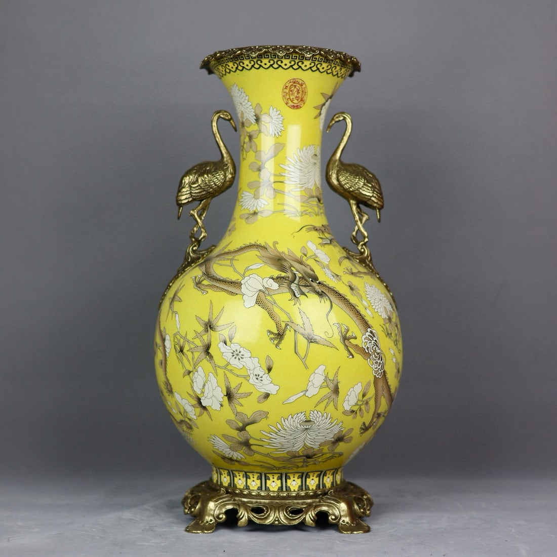 An Exquisite Yellow Glazed Inlaid Bronze Dragon Pattern Flower Pattern Double-Ears Vase: An Exquisite Yellow Glazed Inlaid Bronze Dragon Pattern Flower Pattern Double-Ears Vase Qing Dynasty, China Size:18.9inx9.4in龙纹镶铜仙鹤双耳赏