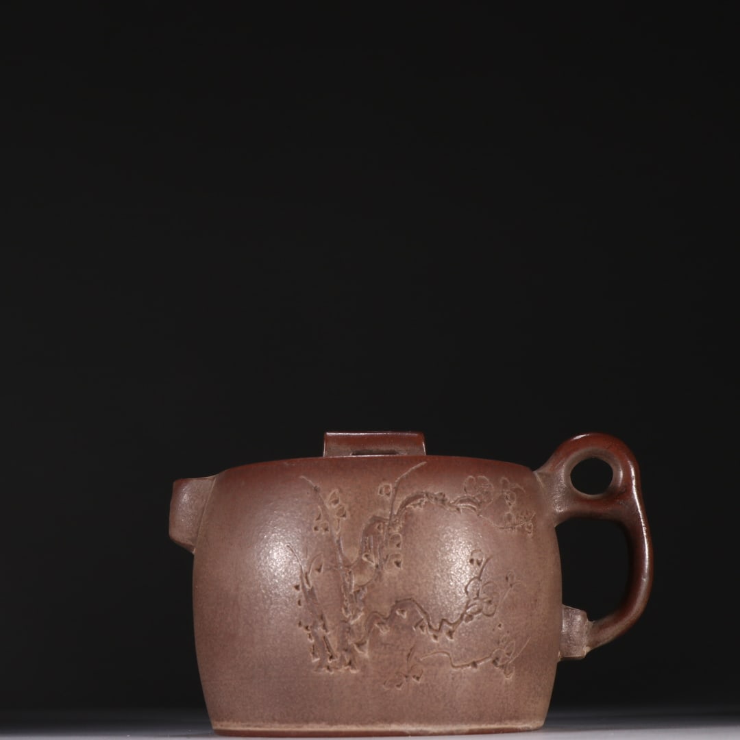 An Exquisite Purple Sands Flower Pattern Teapot: An Exquisite Purple Sands Flower Pattern Teapot Qing Dynasty, China Size:4.2inx6in紫砂梅花纹井栏茶壶 中国清代 Size:10.7cmx