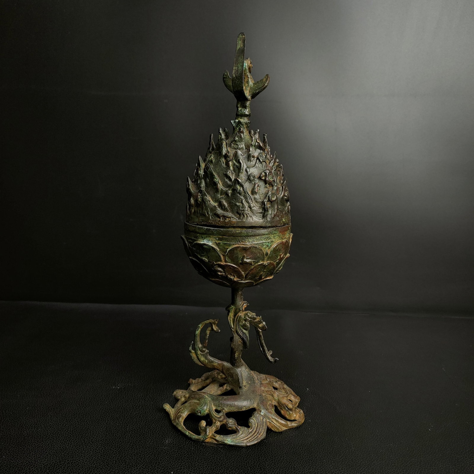 An Archaic Bronze Dragon Pattern Food Vessel,With Bird Cover: An Archaic Bronze Dragon Pattern Food Vessel,With Bird Cover,the Warring States period in China,Size:12.2inx4.7in,Weight:2200g青铜龙纹食器,带鸟盖,