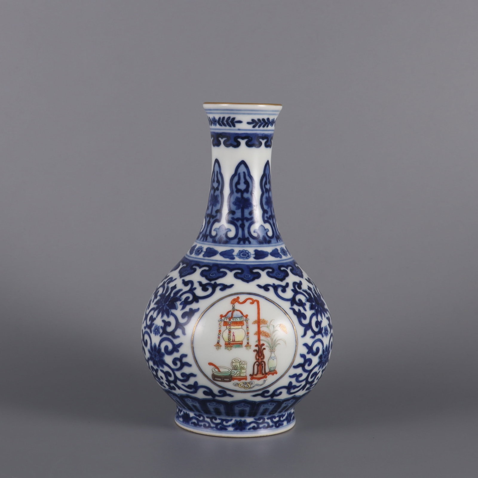An Exquisite Famille-Rose Blue and White Lotus Pattern Vase: An Exquisite Famille-Rose Blue and White Lotus Pattern Vase Qing Dynasty, China Qianlong Six-character MarkSize:7.3inx4.3in粉彩青花缠枝莲纹瓶