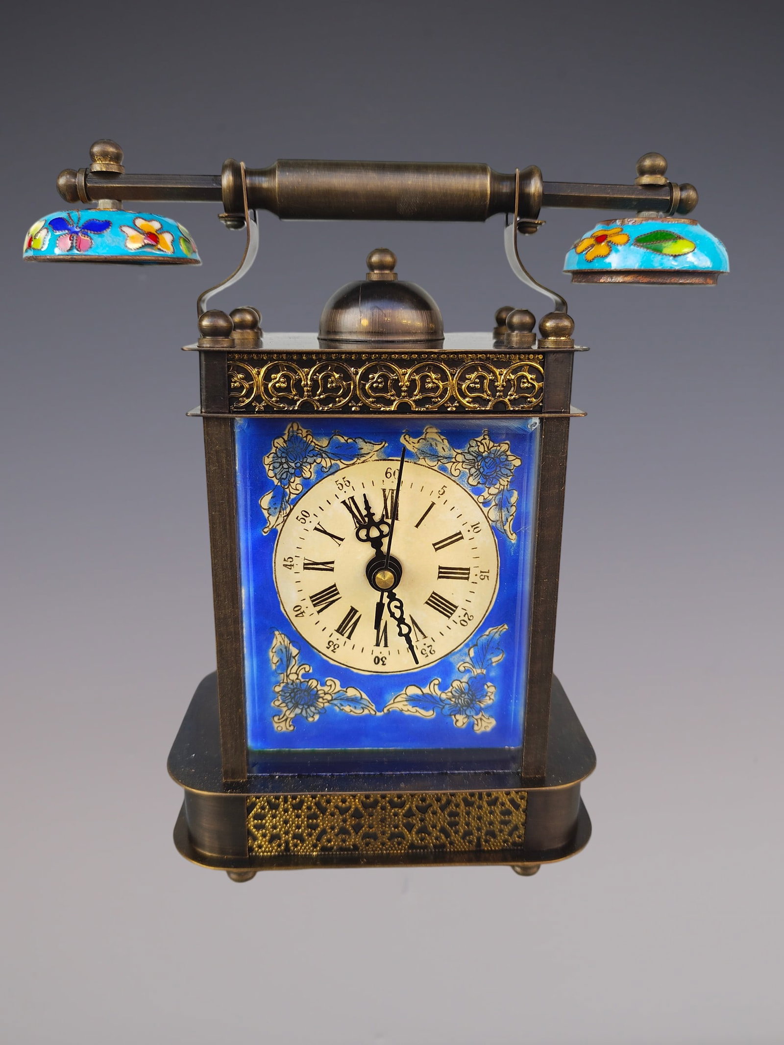 An Exquisite Bronze Lotus Pattern Clock: An Exquisite Bronze Lotus Pattern Clock Size:3.5inx7.1inx7.9in铜缠枝莲纹钟表 Size:9cmx18cmx20cm