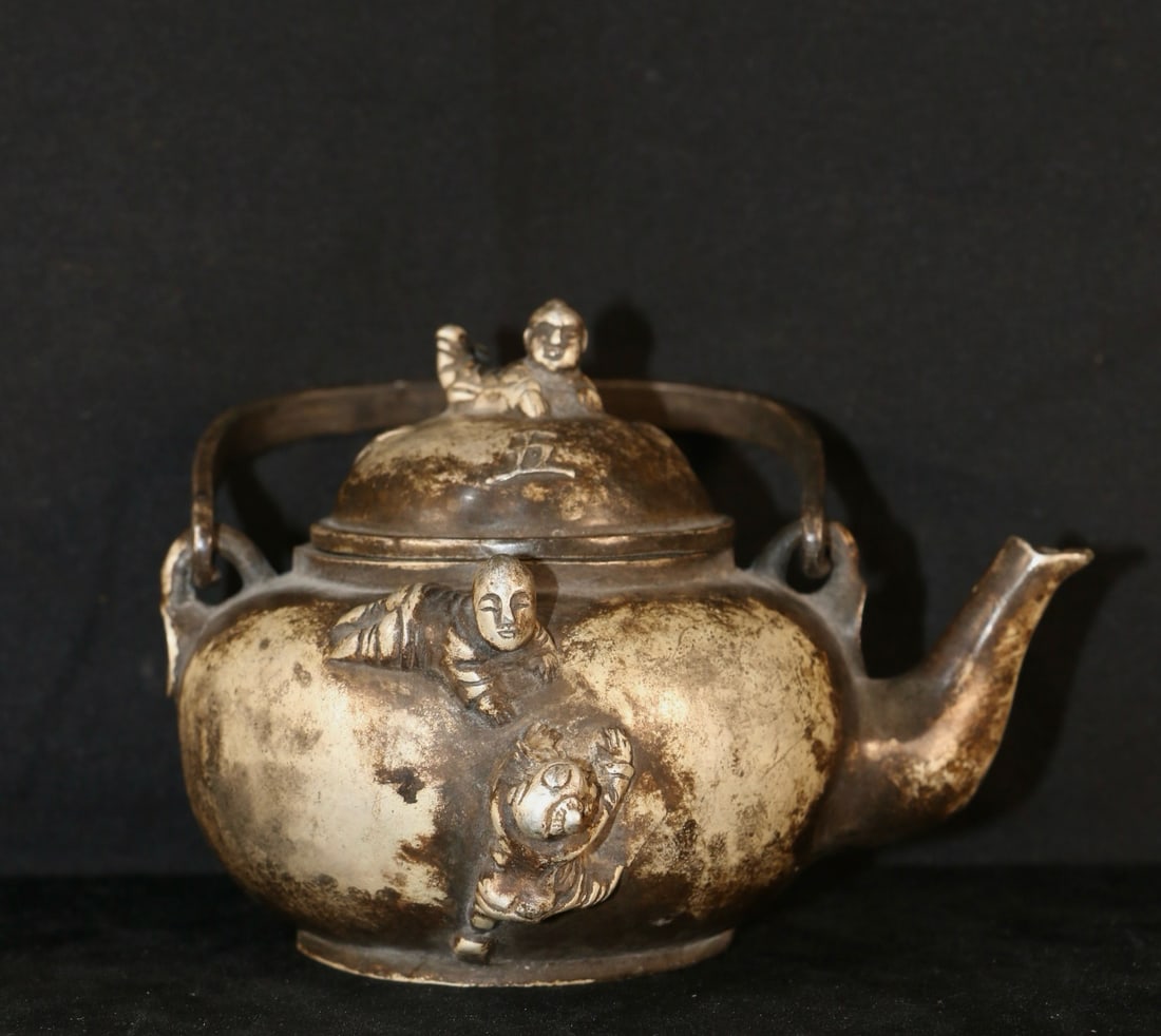 An Exquisite Silver-Gilt Copper Boy Ewer: An Exquisite Silver-Gilt Copper Boy Ewer,Qing Dynasty, China,With Mark,Size:5.7inx5.1inx4.3in ,Weight:441g 铜鎏银童子壶,中国清代,带