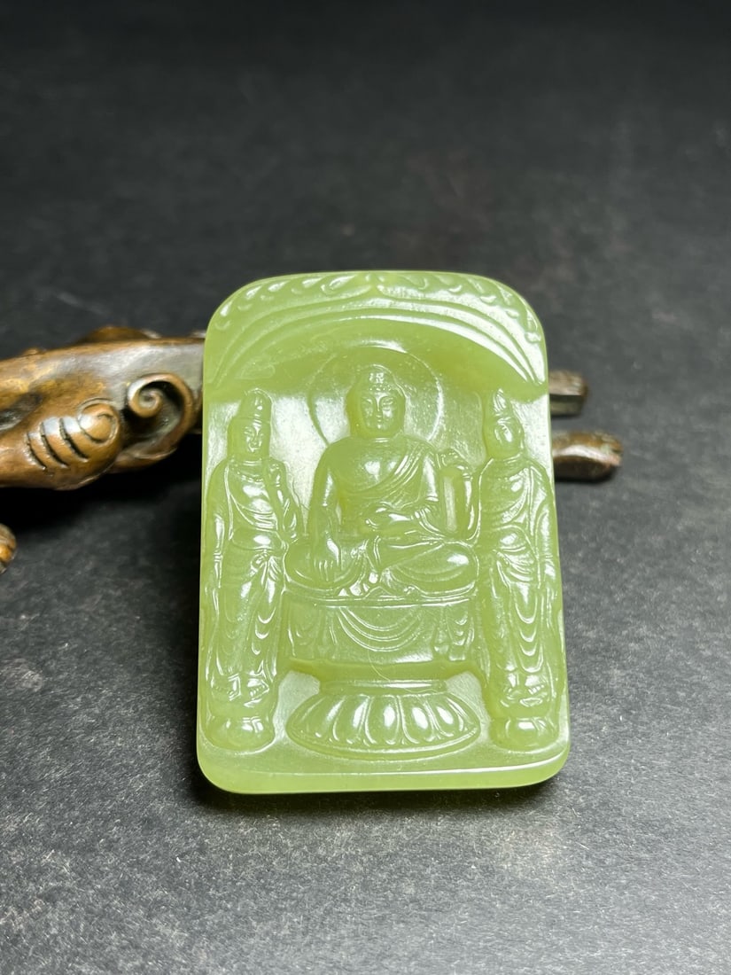 An Exquisite Hotan Yellow Jade Buddha statue pendant: An Exquisite Hotan Yellow Jade Buddha statue pendant,Qing Dynasty, China,Size:1.5inx0.3inx2.2in,Weight:29g 和田黄玉佛玉佩,中国清代