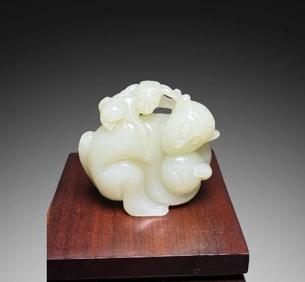 An Exquisite Hotan Jade Monkey Handheld Carving: An Exquisite Hotan Jade Monkey Handheld Carving,Qing Dynasty, China,Size:2.1inx0.7inx2.2in,Weight:85g 和田玉猴手把件,中国清代