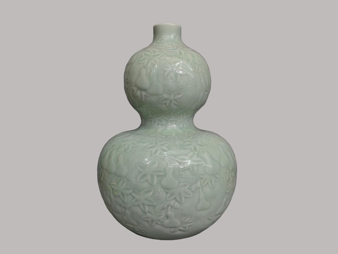 An Exquisite Pea-Green Glaze Gourd Vase: An Exquisite Pea-Green Glaze Gourd Vase,Qing Dynasty, China,Qianlong Six-character Mark,Size:14.6inx2inx5.9inx9.1in