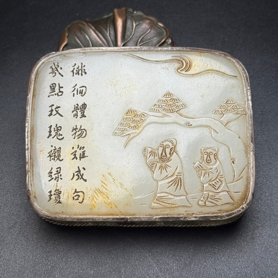 An Exquisite Hotan Jade Figures Pattern Hook: An Exquisite Hotan Jade Figures Pattern Hook,Qing Dynasty, China,Size:3.1inx2.5inx0.6in,Weight:194g 和田玉人物纹腰带扣,中国清
