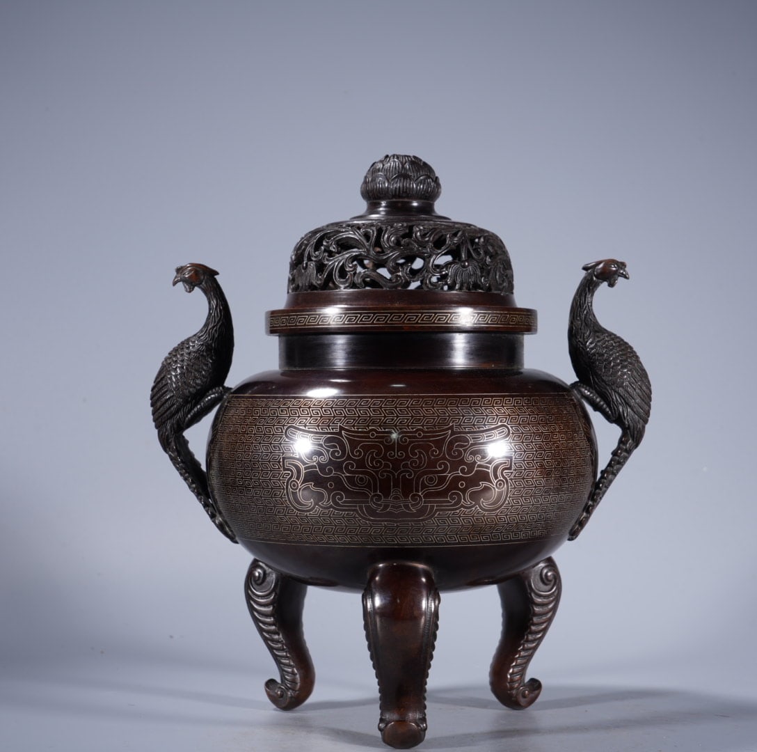 An Exquisite Silver-Inlaid Bronze Phoenix-Ears Censer: An Exquisite Silver-Inlaid Bronze Phoenix-Ears Censer,Ming Dynasty, China,With Mark,Size:8.7inx4.5in ,Weight:4590g 紫铜错银凤耳炉,中国明
