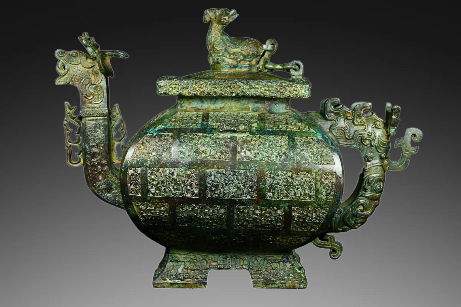 An Exquisite Bronze Dragon Head Sheep Knob Vase: An Exquisite Bronze Dragon Head Sheep Knob Vase,Ancient Time, China,Size:10.6inx14.2in ,Weight:7500g 青铜龙首羊钮瓶,远古时期