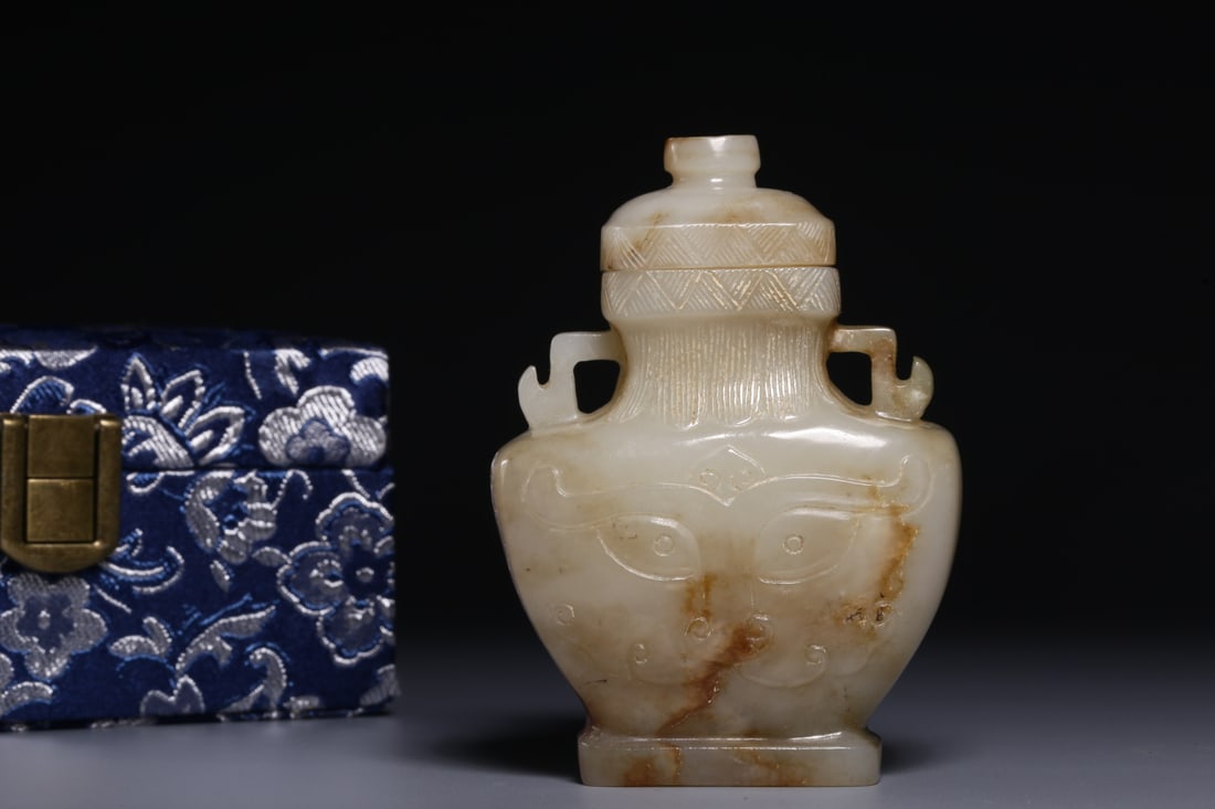 An Exquisite Hotan Jade Beast-Face Pattern Double-Ears Vase: An Exquisite Hotan Jade Beast-Face Pattern Double-Ears Vase,Qing Dynasty, China,Size:3.5inx2.5inx1.2in,Weight:143.5g 和田玉兽面纹双耳瓶,中&#