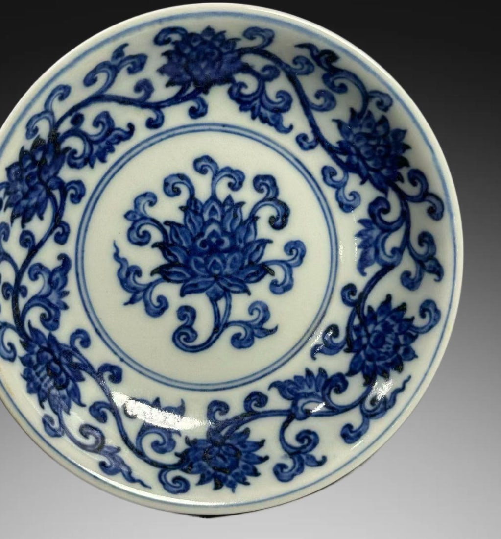 An Exquisite Blue and White Lotus Pattern Plate: An Exquisite Blue and White Lotus Pattern Plate,Ming Dynasty, China,Xuande Six-character Mark,Size:5.7inx1.4in 青花缠枝莲纹盘,中国明代