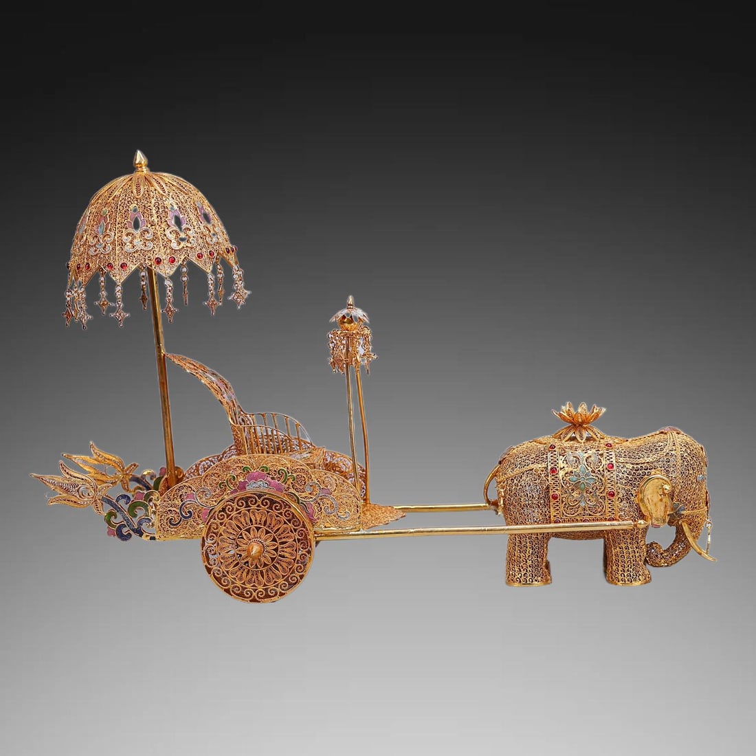 An Exquisite Gilt Bronze Elephant Pulling Cart Ornament: An Exquisite Gilt Bronze Elephant Pulling Cart Ornament,Qing Dynasty, China,Qianlong Four-character Mark,Size:11.8inx18.1in ,Weight:1535g