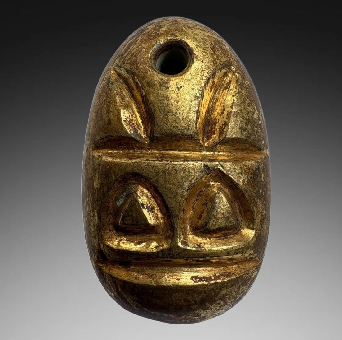 An Exquisite Gilt Bronze Coin: An Exquisite Gilt Bronze Coin,Han Dynasty, China,Size:1.3inx0.8in,Weight:30g 铜鎏金鬼脸金钱,中国汉代