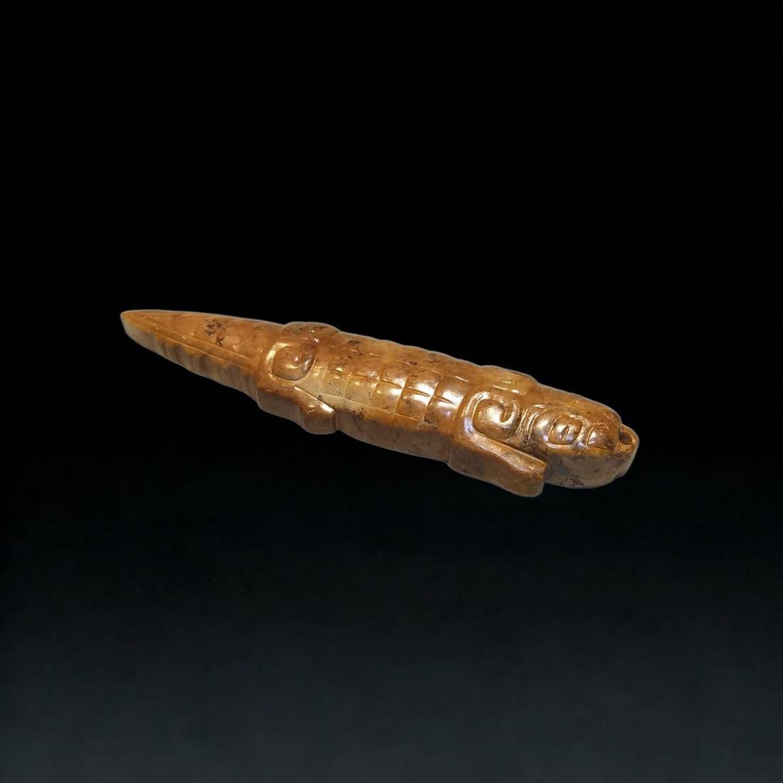 An Exquisite Hotan Jade Crocodile Ornament: An Exquisite Hotan Jade Crocodile Ornament,Ancient Time, China,Size:0.4inx0.8inx3.3in,Weight:23.9g 和田玉鳄鱼配饰,远古时期