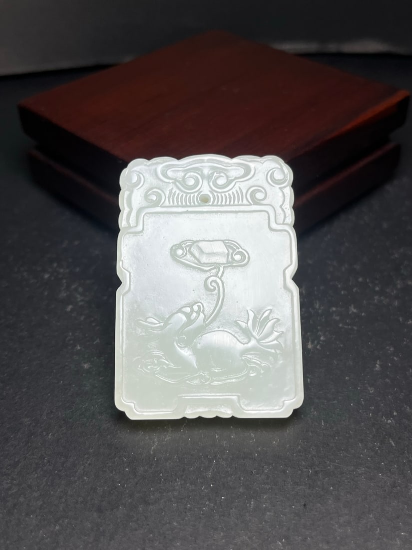 An Exquisite Hotan Jade Kylin Pattern pendant: An Exquisite Hotan Jade Kylin Pattern pendant,Qing Dynasty, China,Size:1.5inx0.3inx2.2in,Weight:38g 和田玉麒麟纹玉佩,中国清代
