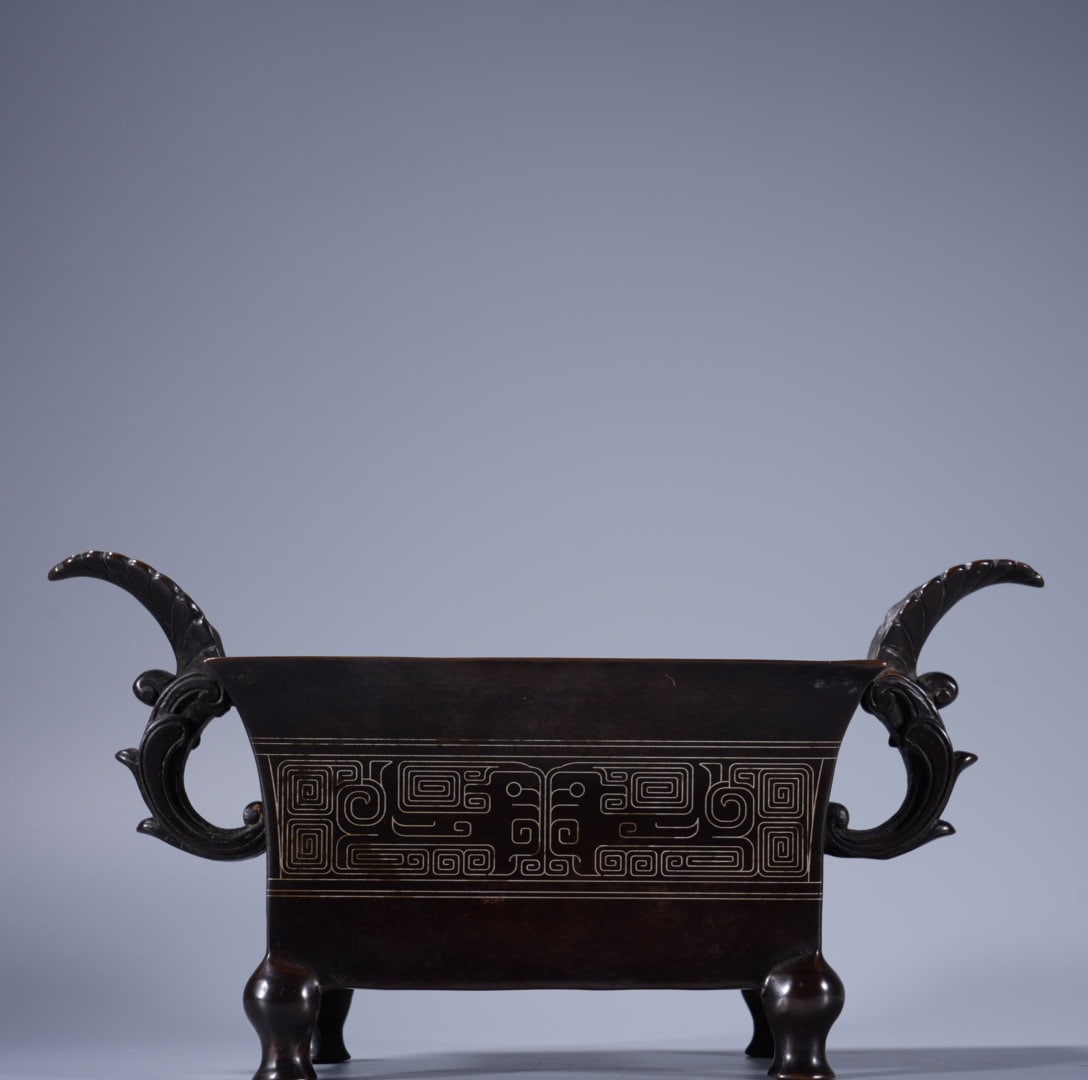 An Exquisite Silver-Inlaid Bronze Phoenix-Ears Censer: An Exquisite Silver-Inlaid Bronze Phoenix-Ears Censer,Ming Dynasty, China,With Mark,Size:4.3inx6in ,Weight:1930g 紫铜错银凤耳炉,中国明ߣ
