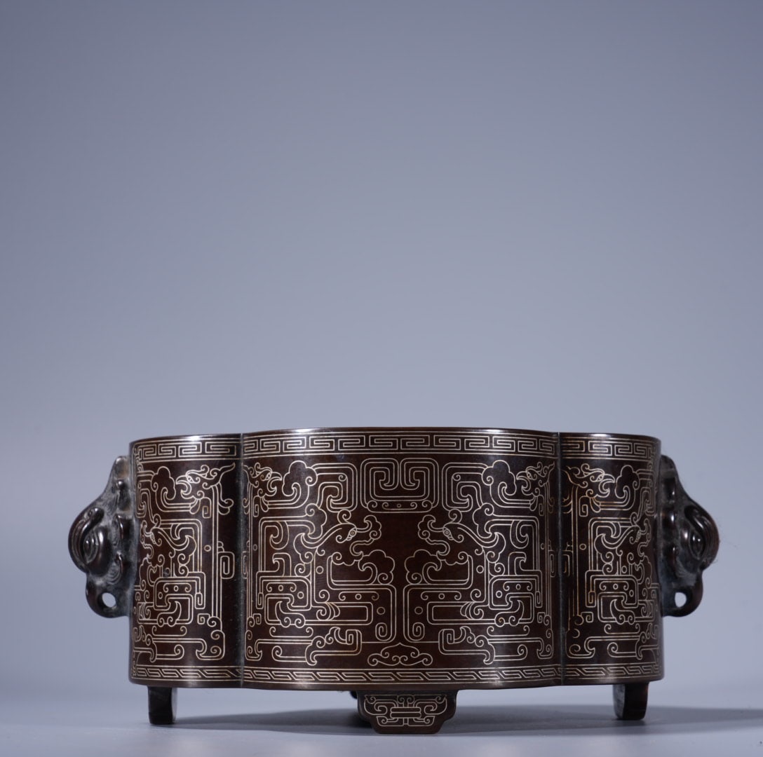 An Exquisite Silver-Inlaid Bronze Beast-Ears Censer: An Exquisite Silver-Inlaid Bronze Beast-Ears Censer,Ming Dynasty, China,With Mark,Size:3inx5.9in ,Weight:2225g 紫铜错银兽耳炉,中国明代