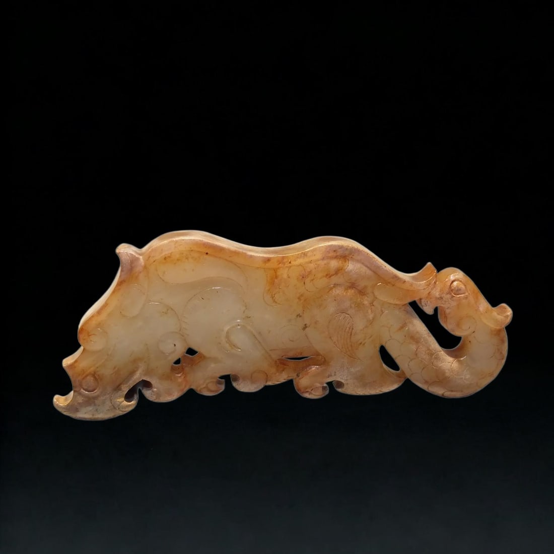 An Exquisite Hotan White Jade Rhinoceros Pendant: An Exquisite Hotan White Jade Rhinoceros Pendant,Han Dynasty, China,Size:1.2inx3.1inx0.2in,Weight:28.2g 和田白玉犀牛佩,中国汉代