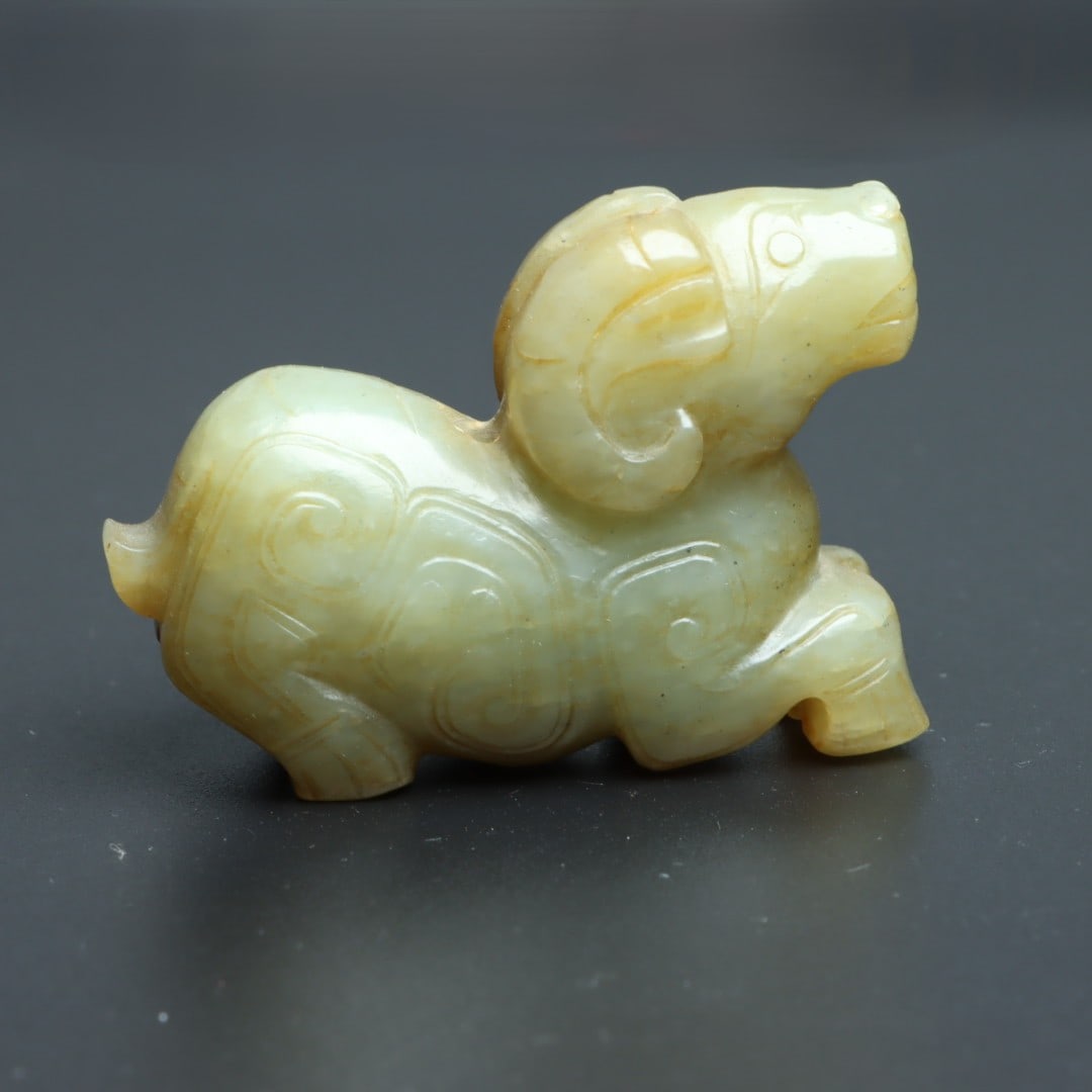 An Exquisite Hotan Jade Sheep Ornament: An Exquisite Hotan Jade Sheep Ornament,Ancient Time, China,Size:2.3inx1.6inx0.8in,Weight:78.4g 和田玉羊摆件,远古时期