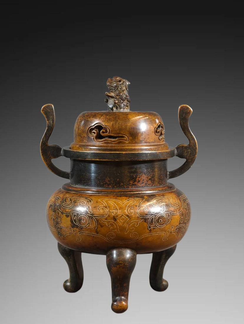 An Exquisite Bronze Body Inlaid Silver Wire Beast Knob Tripod Censer: An Exquisite Bronze Body Inlaid Silver Wire Beast Knob Tripod Censer,Ming Dynasty, China,With Mark,Size:8.9inx6.3in ,Weight:3800g