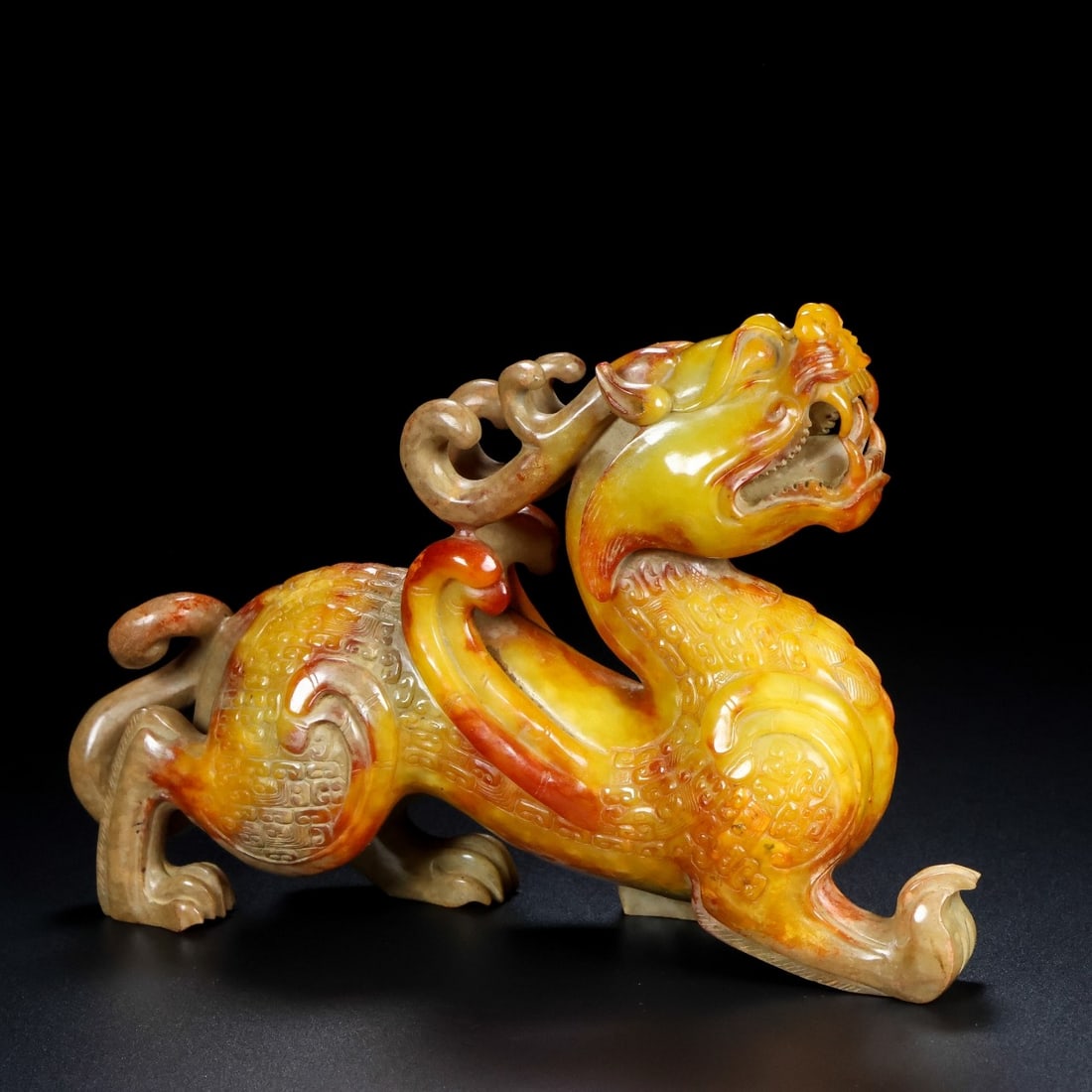 An Exquisite Hotan Jade Auspicious Beast Ornament: An Exquisite Hotan Jade Auspicious Beast Ornament,Han Dynasty, China,Size:7.9inx2inx5.1in,Weight:1035g 和田玉瑞兽摆件,中国汉代
