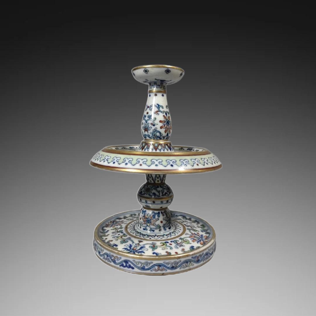 An Exquisite Doucai Flower Pattern Candlestick: An Exquisite Doucai Flower Pattern Candlestick,Qing Dynasty, China,Qianlong Four-character Mark,Size:6.9inx5.3in 斗彩花卉纹蜡烛台,中国଀