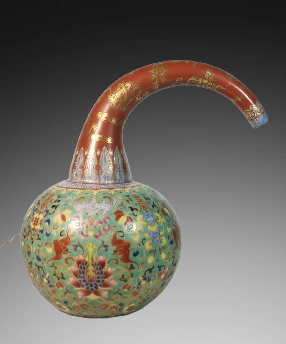 An Exquisite Famille-Rose Green Ground Lotus Pattern Bottle: An Exquisite Famille-Rose Green Ground Lotus Pattern Bottle,Qing Dynasty, China,Qianlong Four-character Mark,Size:9.4inx6.3in