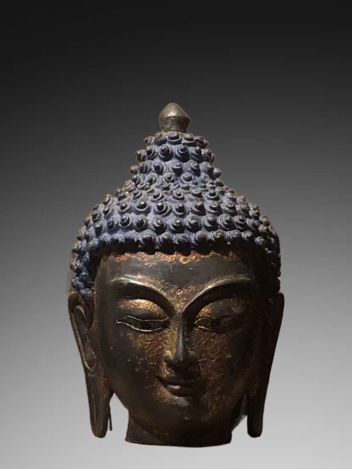 An Exquisite Bronze Lacquered Gold Buddha Head Ornament (1 of 8)