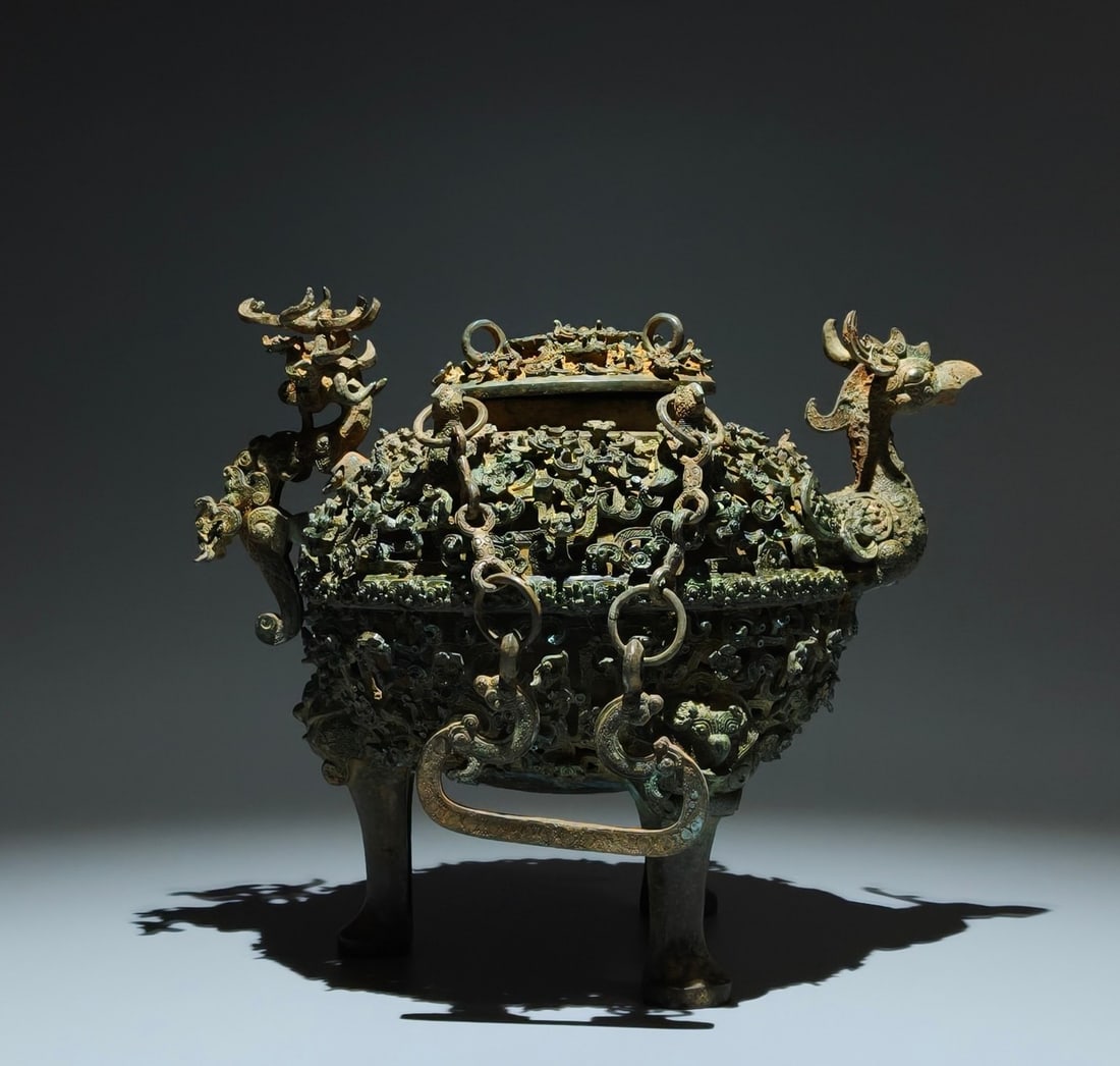 An Exquisite Bronze Dragon and Phoenix Ears Tripod Censer: An Exquisite Bronze Dragon and Phoenix Ears Tripod Censer,Han Dynasty, China,Size:9.6inx11.4inx7.9in 青铜龙凤耳三足炉,中国汉代