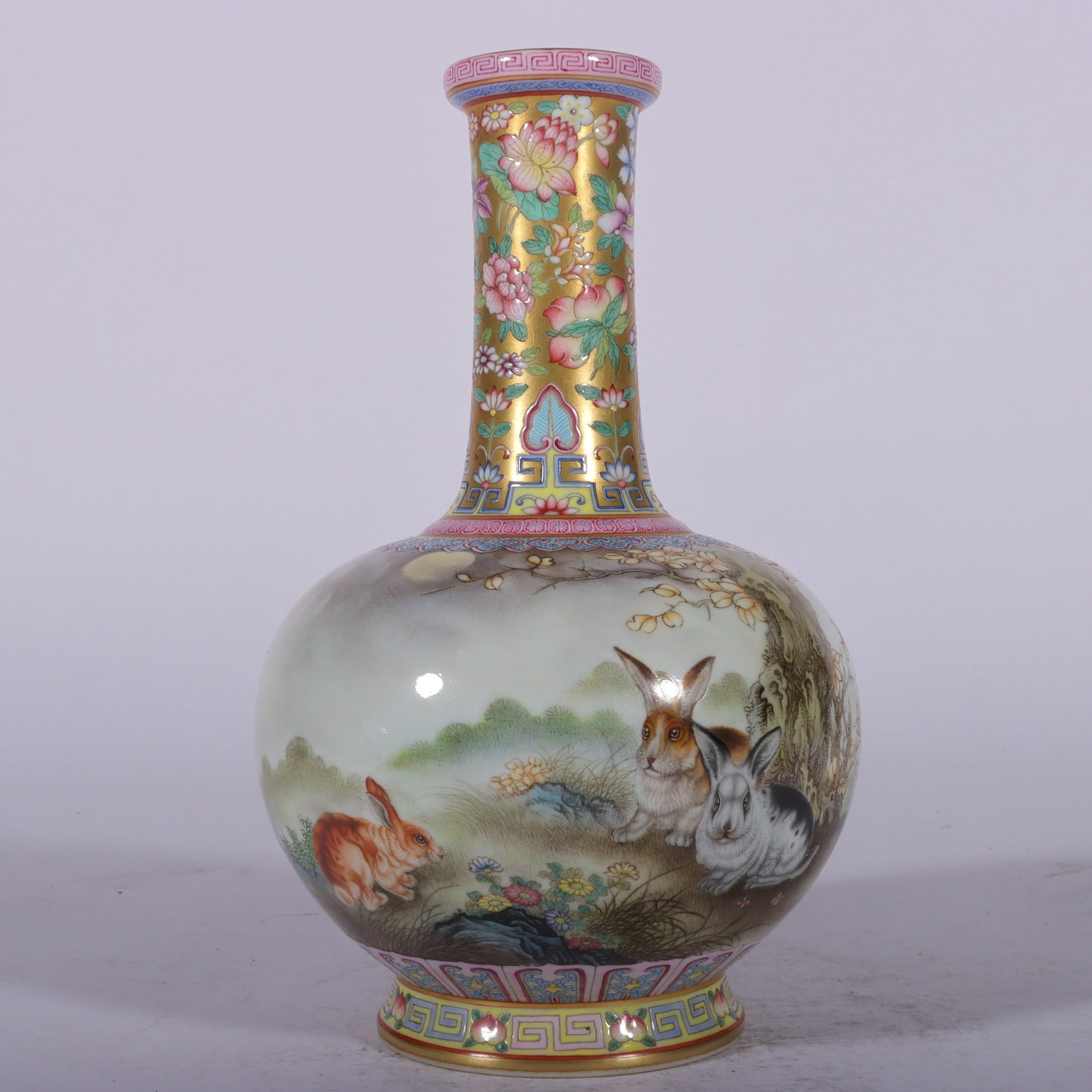 An Exquisite Enamel Gold Ground Rabbit Pattern Vase: An Exquisite Enamel Gold Ground Rabbit Pattern Vase,Qing Dynasty, China,Qianlong Four-character Mark,Size:7.7inx1.7inx4.5inx2.9in 珐琅彩金地兔纹瓶,È