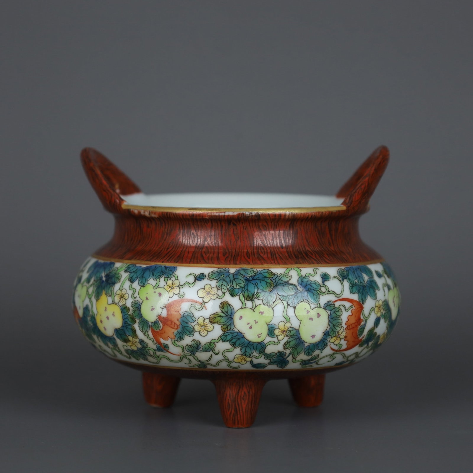 An Exquisite Wood-Grain Glazed Famille-Rose Gourd Pattern Tripod Censer: An Exquisite Wood-Grain Glazed Famille-Rose Gourd Pattern Tripod Censer,Qing Dynasty, China,Yongzheng Four-character Mark,Size:3.9inx4.9in