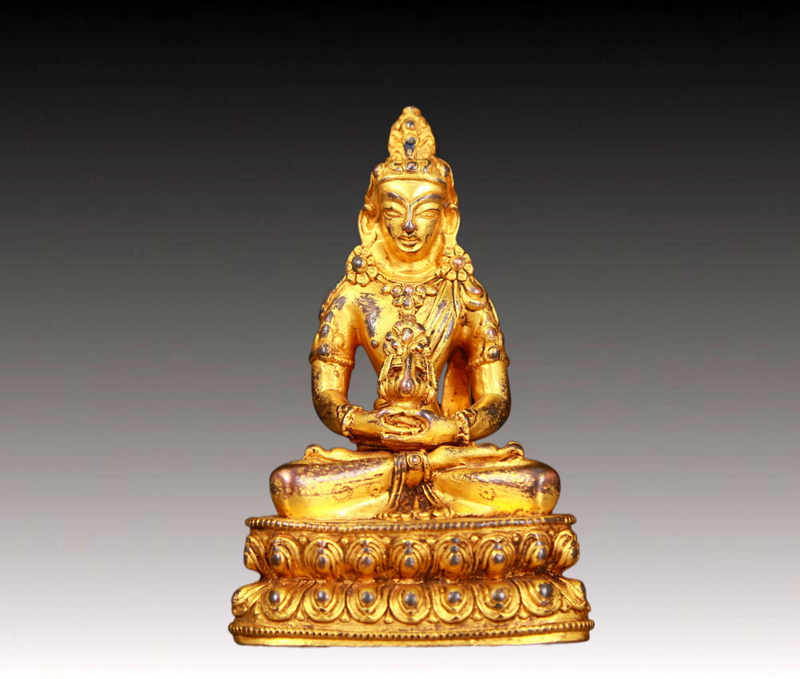 An exquisite gilt bronze statue of Infinite Life
