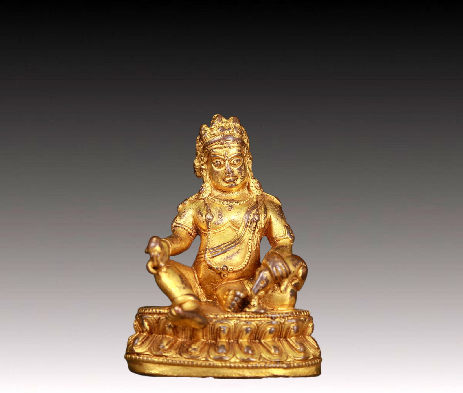 An exquisite gilt bronze statue of Mammon