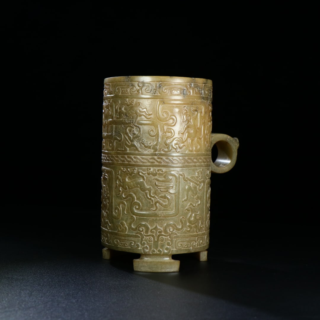 An Exquisite White Jade Auspicious Animal Pattern Cup: An Exquisite White Jade Auspicious Animal Pattern Cup,Han Dynasty,China,Size:5.3inx4.5in,Weight:467g,白玉瑞兽纹杯,中国汉代