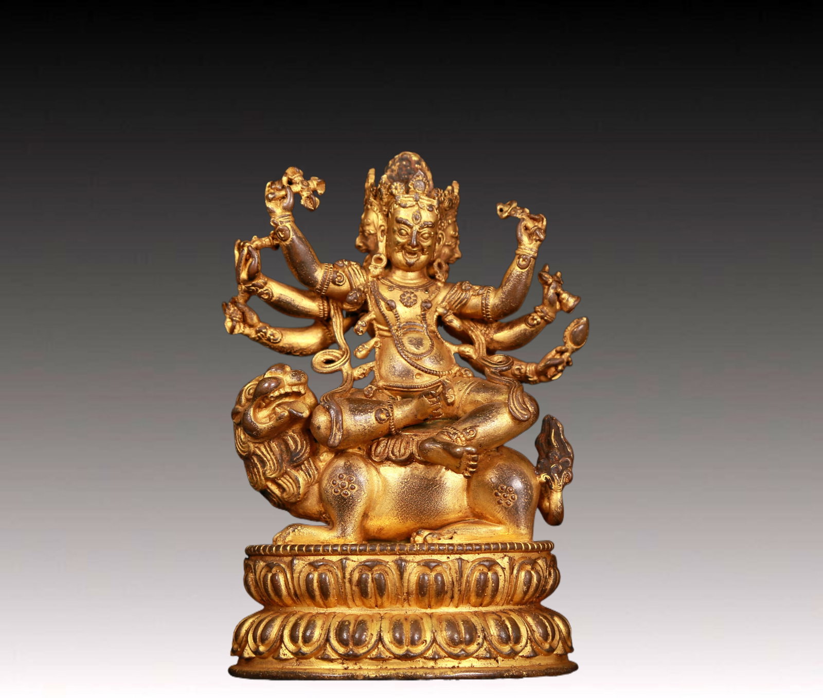 An exquisite gilt bronze statue of Vajra riding a lion