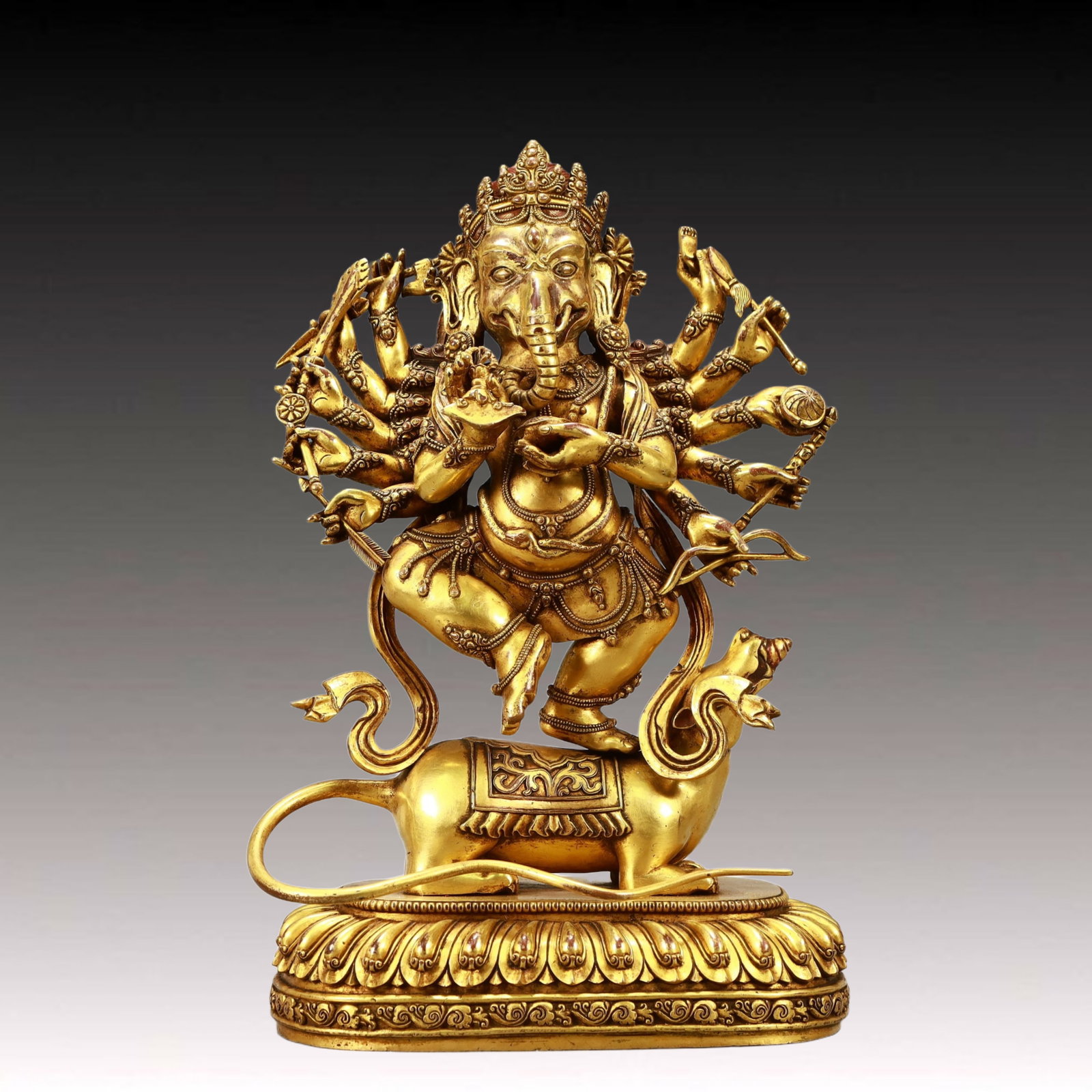 A Solemn Gilt Bronze Statue of Ganesh: A Solemn Gilt Bronze Statue of Ganesh,Ming Dynasty,China,Size:7.5inx3.9inx12.6in,Weight:4200g,铜鎏金象鼻财神像,中国明代