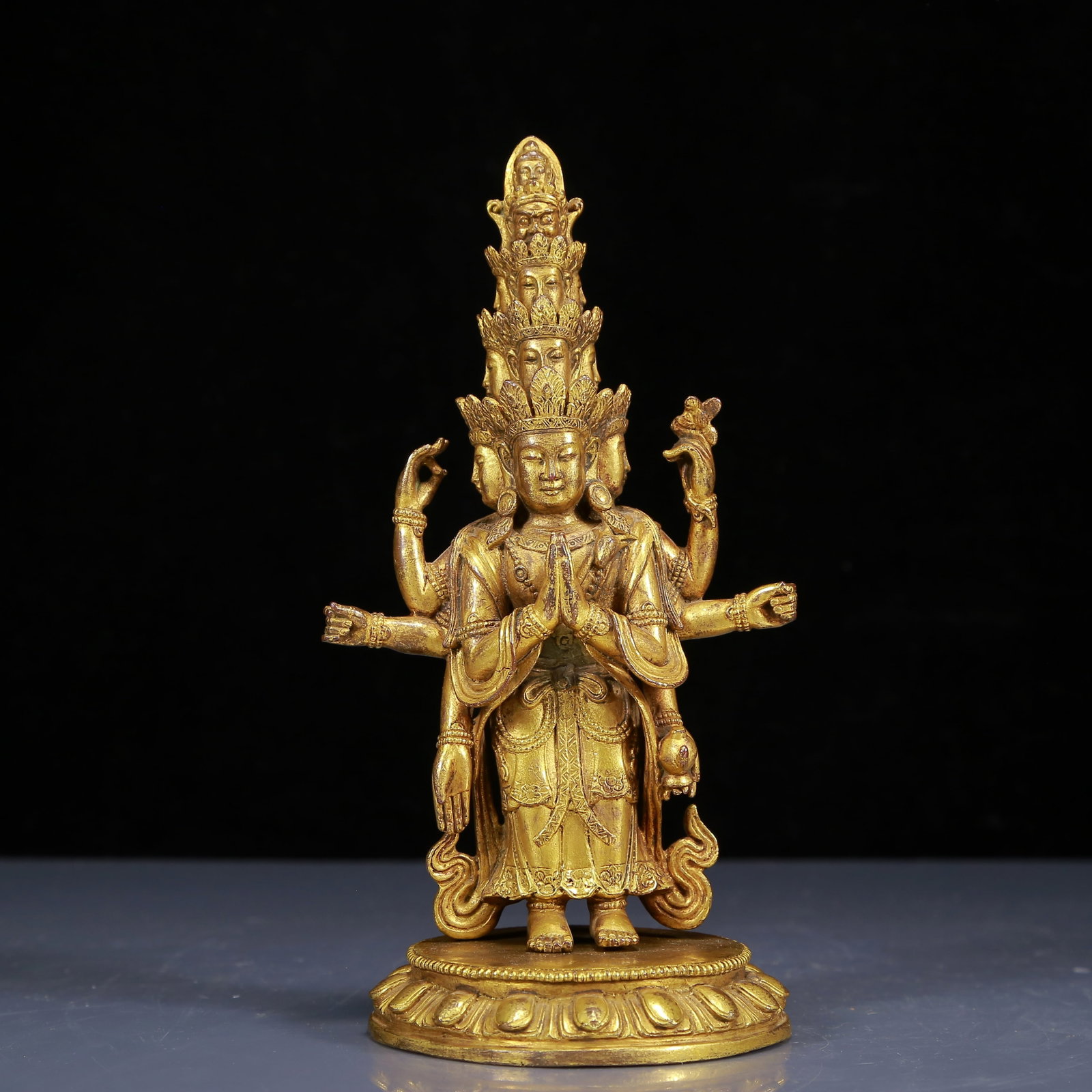 A Solemn Gilt Bronze Statue of Eleven-Headed and Six-Armed Guanyin: A Solemn Gilt Bronze Statue of Eleven-Headed and Six-Armed Guanyin,Ming Dynasty,China,Size:3.9inx8.7in,Weight:1405g,铜鎏金十一面六臂观音