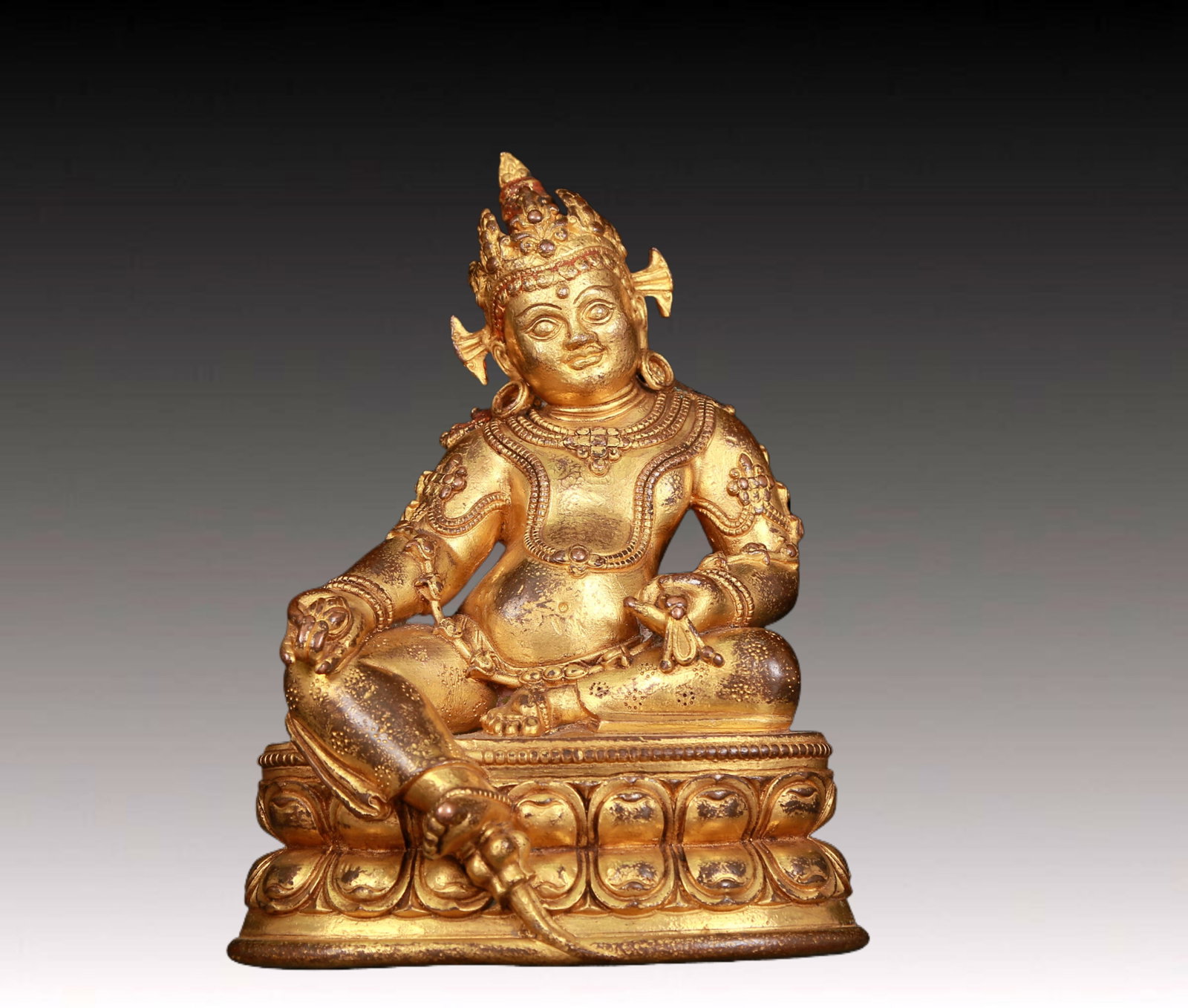 An exquisite gilt bronze statue of Mammon