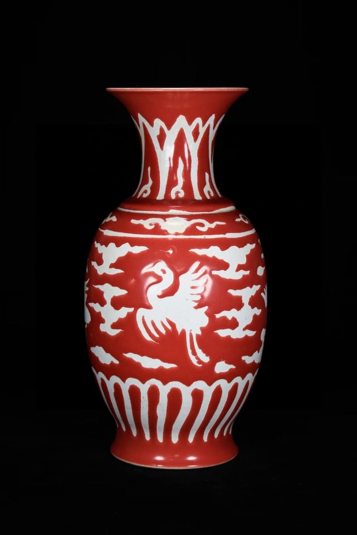 An Exquisite Red Glaze Auspicious Cloud and Crane Pattern Vase: An Exquisite Red Glaze Auspicious Cloud and Crane Pattern Vase,Yuan Dynasty,China,Size:13.8inx7.1in,红釉祥云鹤纹瓶,中国元代