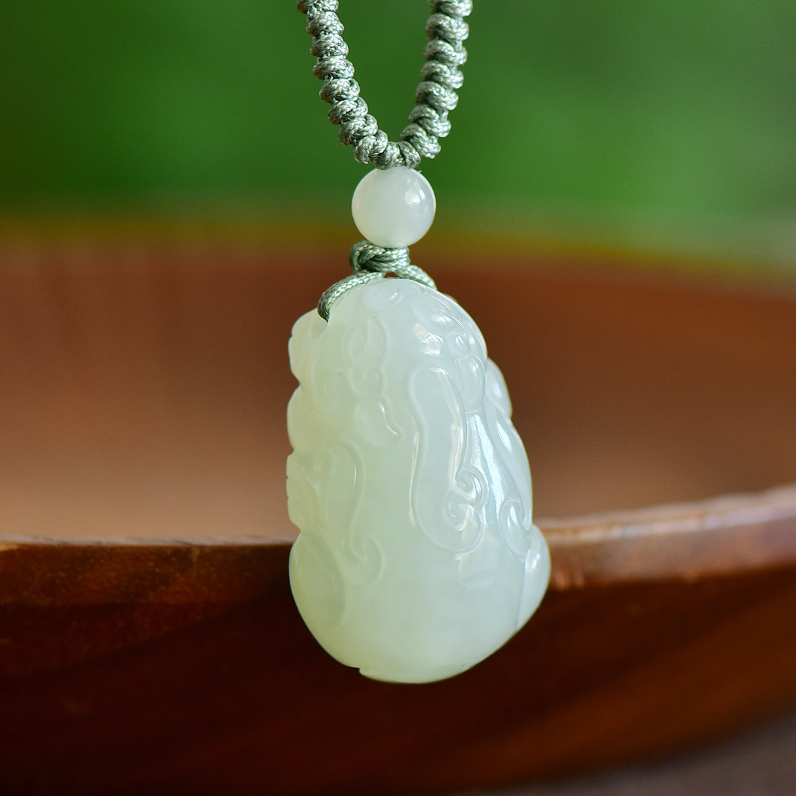 An Exquisite White Jade Auspicious Beast Pendant (1 of 5)