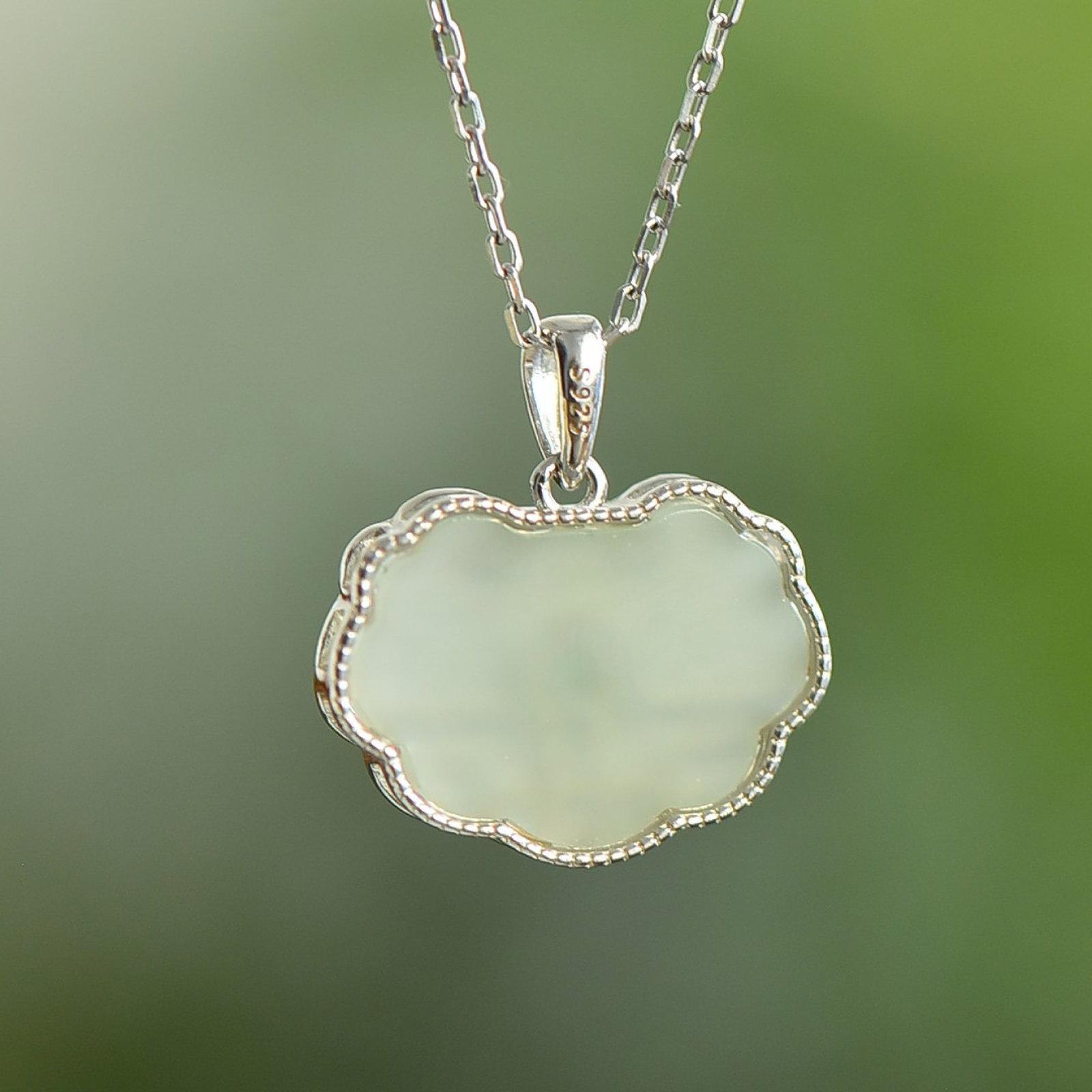 An Exquisite Sterling Silver Inlaid White Jade Pendant: An Exquisite Sterling Silver Inlaid White Jade Pendant 纯银镶白玉吊坠
