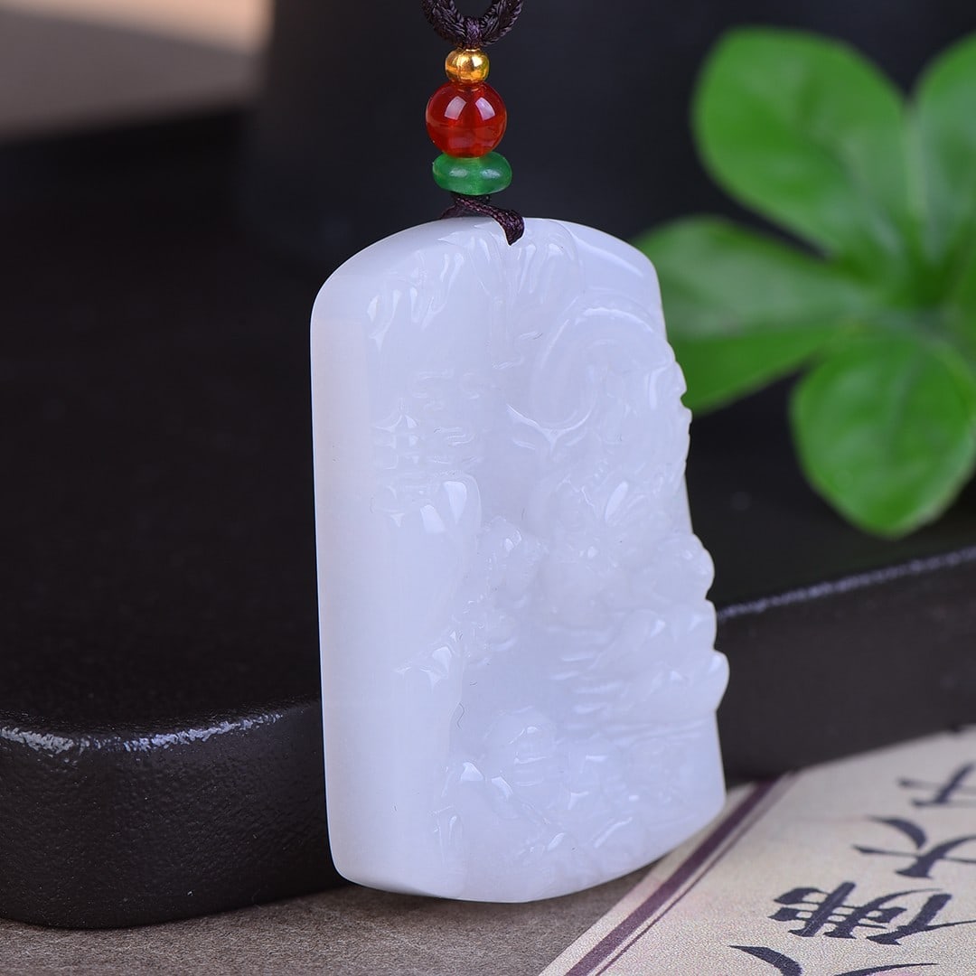 An Exquisite White Jade Landscape and Dragon Pattern Pendant: An Exquisite White Jade Landscape and Dragon Pattern Pendant,Size:32mmx50mm 寓意:吉祥安康 白玉山水龙纹牌