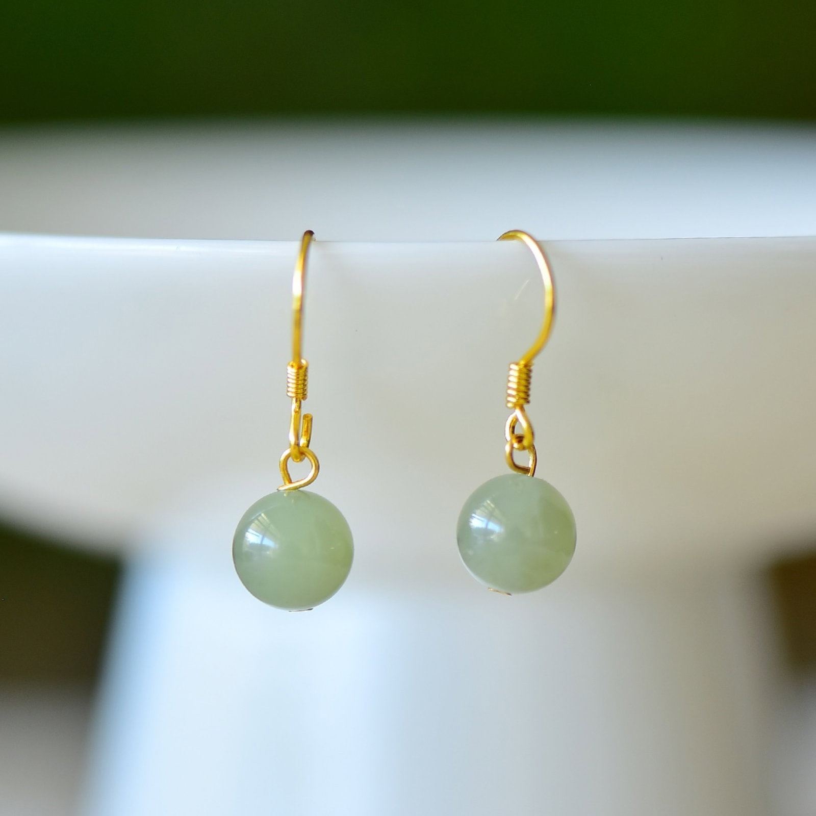 A Pair of Exquisite Sterling Silver-Gold Plated Inlaid Greenish Jade Earrings: A Pair of Exquisite Sterling Silver-Gold Plated Inlaid Greenish Jade Earrings,Size:8mmx8mm 一对纯银镀金镶青玉耳环