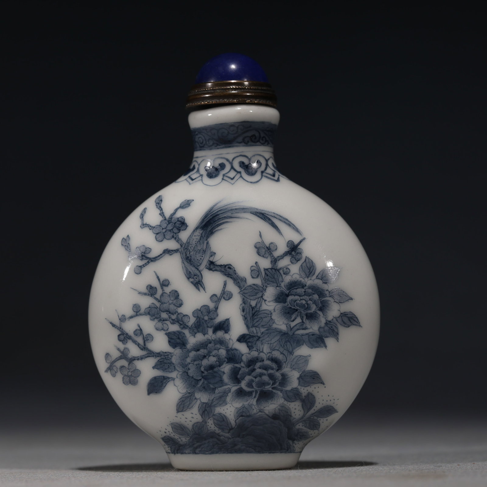 An Exquisite Blue And White Flat Bottle-Shaped Snuff Bottle With Flower And Bird Pattern: An Exquisite Blue And White Flat Bottle-Shaped Snuff Bottle With Flower And Bird Pattern,China,Qing Dynasty,Four-Character Qianlong Mark,Dimensions:3.1inx2.2in,青花花鸟纹