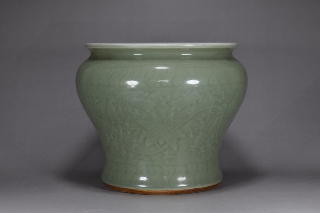 An Exquisite Celadon Glazed Lotus Pattern Jar (1 of 9)