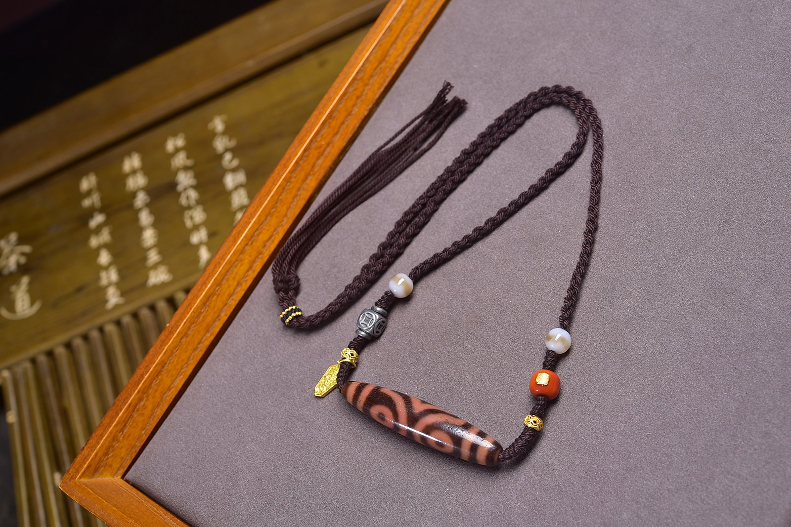 An Exquisite Three Eyes Dzi Bead Pendant: An Exquisite Three Eyes Dzi Bead Pendant,Size:58.7mmx12.8mm,Weight:23g 三眼天珠挂件