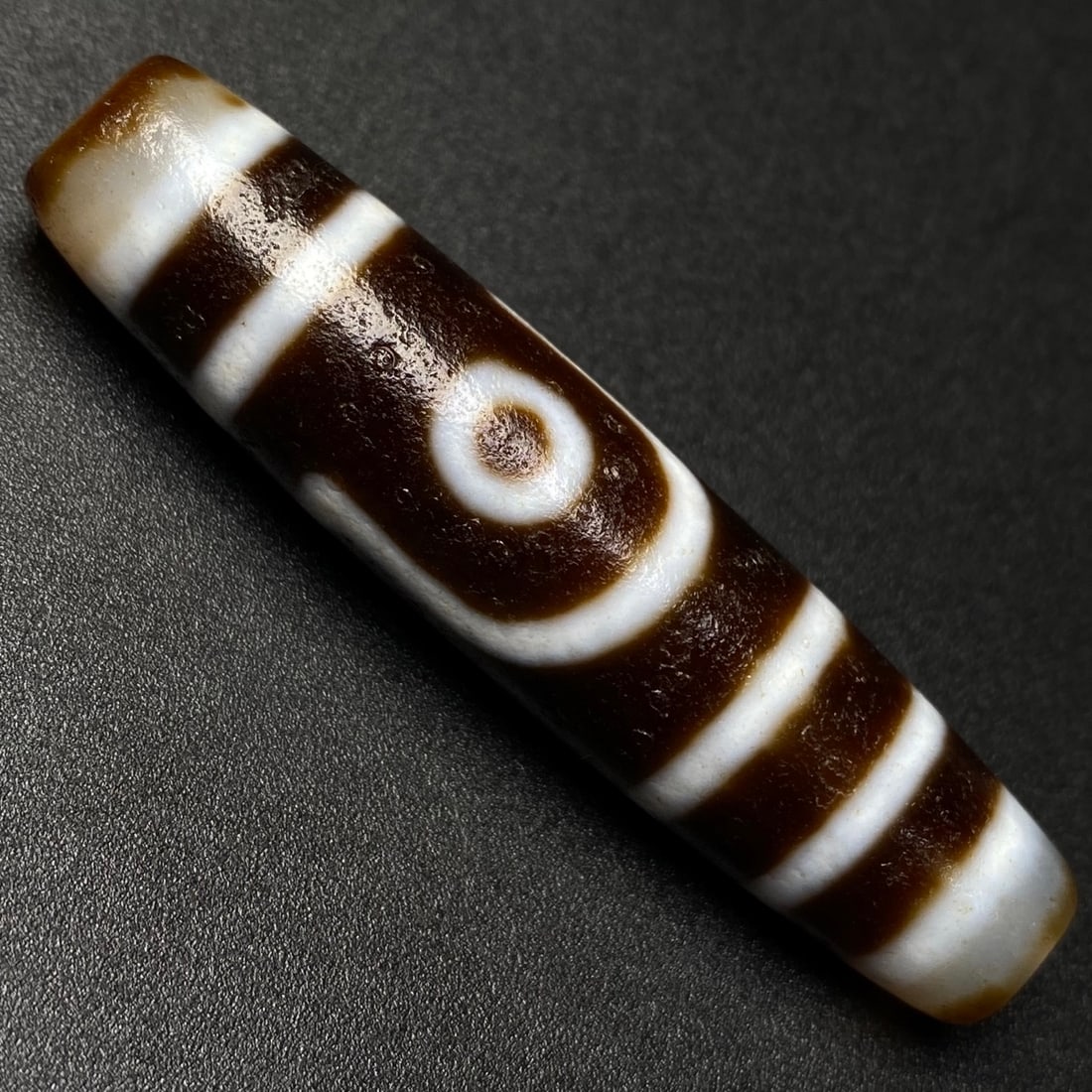An Exquisite Two Eyes Dzi Bead Pendant: An Exquisite Two Eyes Dzi Bead Pendant,Size:57mmx13mm,Weight:15.1g 两眼天珠挂件